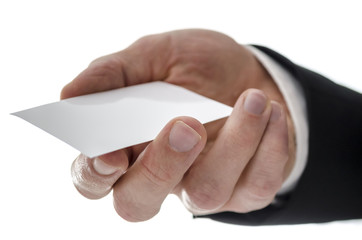 Closeup of a business man handing a business card