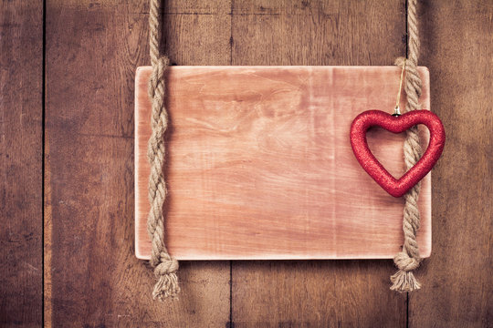 Valentine heart, wooden frame with rope hanging on wall