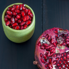 Pomegranate seeds portion in green pottery