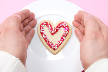 Love concept - hands around heart