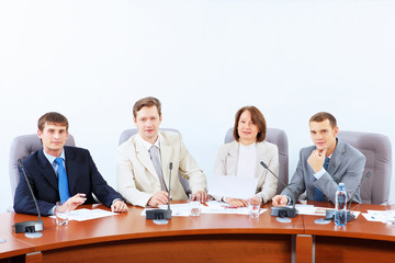 Four businesspeople at meeting