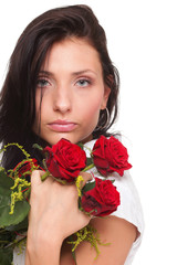 Closeup portrait of attractive young woman holding a red rose