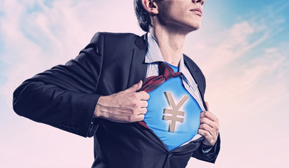 Businessman showing superman suit underneath shirt