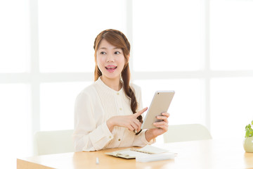 Beautiful asian woman relaxing in the room