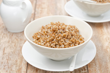 Boiled buckwheat in a white bowl horizontal