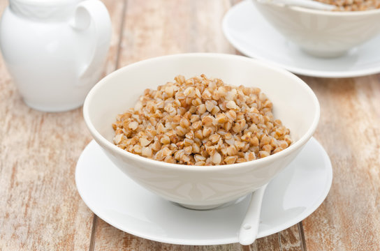 Boiled buckwheat in a white bowl horizontal