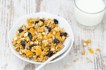 pumpkin granola with dried fruit and seeds in a bowl top view