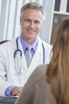 Male Hospital Doctor Talking to Female Patient