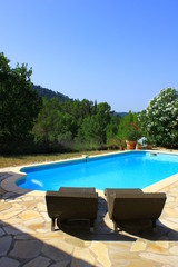 Relaxation at  the swimmingpool in Provence, France