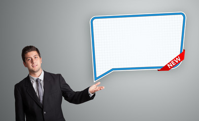young man presenting modern speech bubble copy space