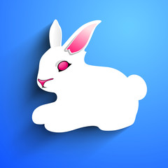 Little Easter rabbit on blue background.