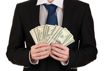 Business man holds lot of money isolated on white