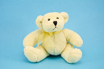 white polar bear toy on azure background