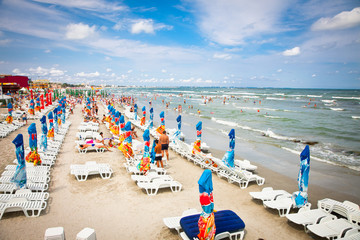 Crowded beach with tourists  in Costinesti, Romania.