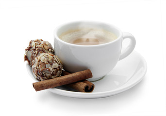 cup of coffee with chocolates and cinnamon