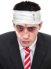 Close-up man with bruised eyes and head, funny businessman
