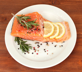 Fresh salmon fillet with herbals and lemon slices
