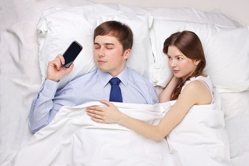 businessman and woman in bed