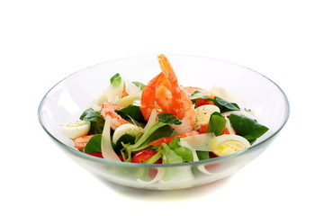 Salad with eggs, shrimp and cheese in glass bowl