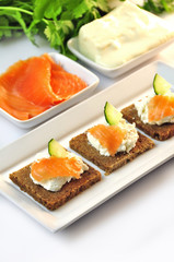 canapes rye bread with ricotta cheese and smoked salmon