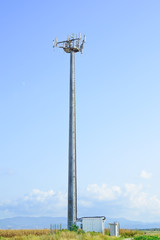 Telecommunications tower. Mobile phone station in a blue sky