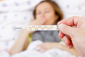 Sick woman have temperature