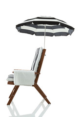 Beach chair with umbrella and towel