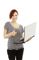 Young woman with laptop giving the OK sign