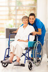 elderly woman and young caregiver at home