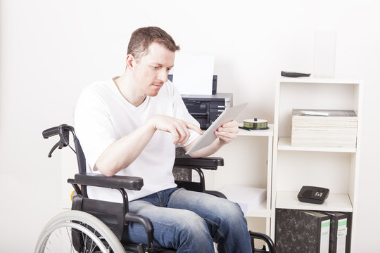 Man in wheelchair at work