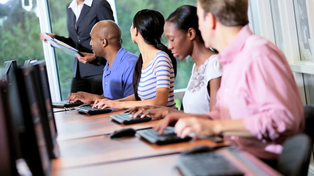 IT College Students Working with Tutor