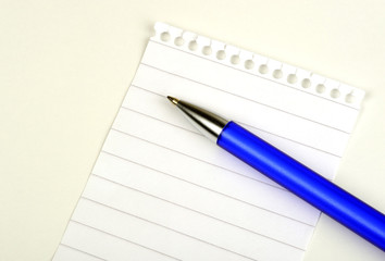 Empty page from notepad with blue pen