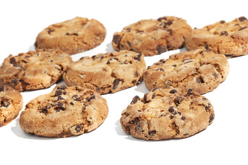 Chocolate cookies aligned, isolated on white background