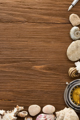 seashell and compass on wood