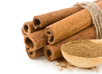 cinnamon sticks and powder on white