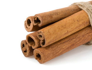 cinnamon sticks on white