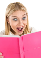Shocked attractive woman reading book or diary
