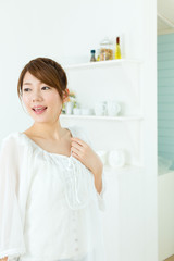 Beautiful asian woman relaxing in the room