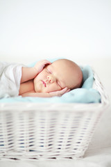 Baby sleeping in a basket