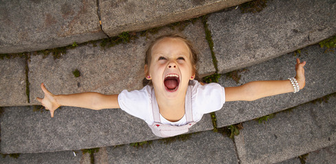 screaming girl with upturned face