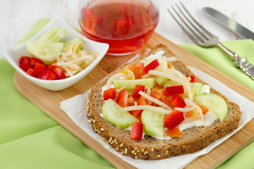 toast with cheese, pepper, cucumber on the plate