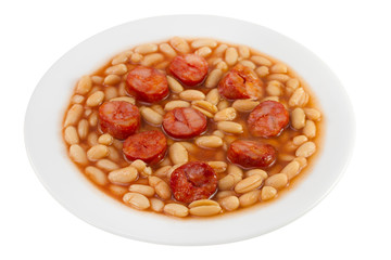 fried sausages with beans on the plate on white background