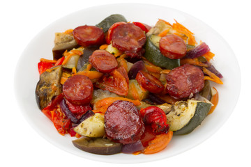 chourico with vegetables on the plate on white background
