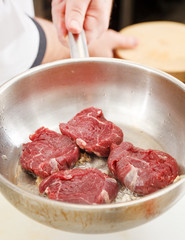 beef steak in a frying pan