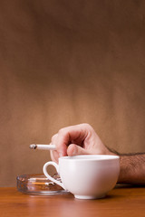 Hand holding a cigarette