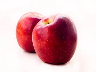 two red apple against white background