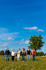 Family and multi-generation - fun on meadow in summer