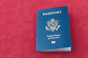 American passport  on red background.