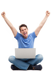 Man with fists up using laptop