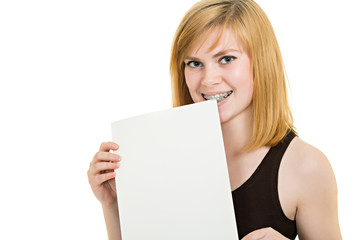 Smiling girl with brackets and white billboard